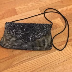 Black and silver beaded clutch bag with black cord